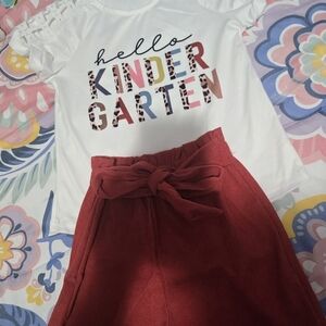 Playful White Graphic Tee and Red Skirt Set